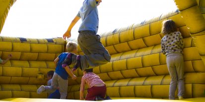 Kids jumping on castle